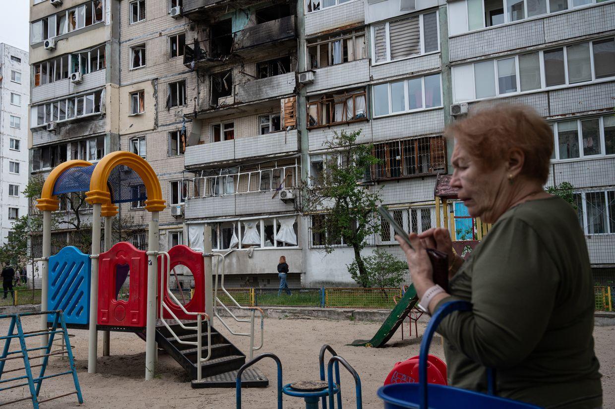 A local resident stands at the site of a Russian drone attack in Kyiv, Ukraine, in May 2025