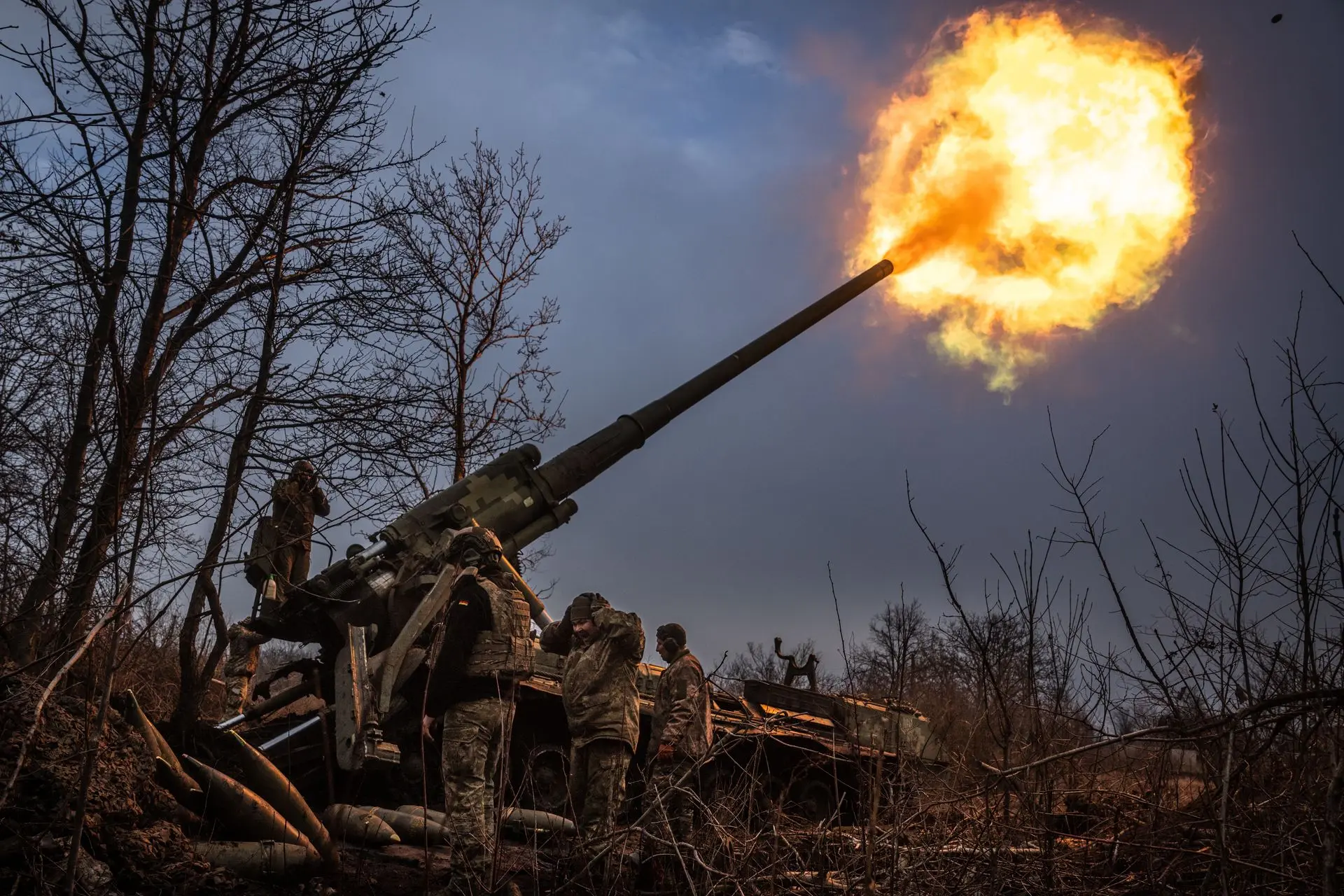 Ukrainian soldiers of 43rd Brigade are seen working on a Soviet era Pion self propelled howitzer in the direction of Chasiv Yar, Ukraine in January 2025