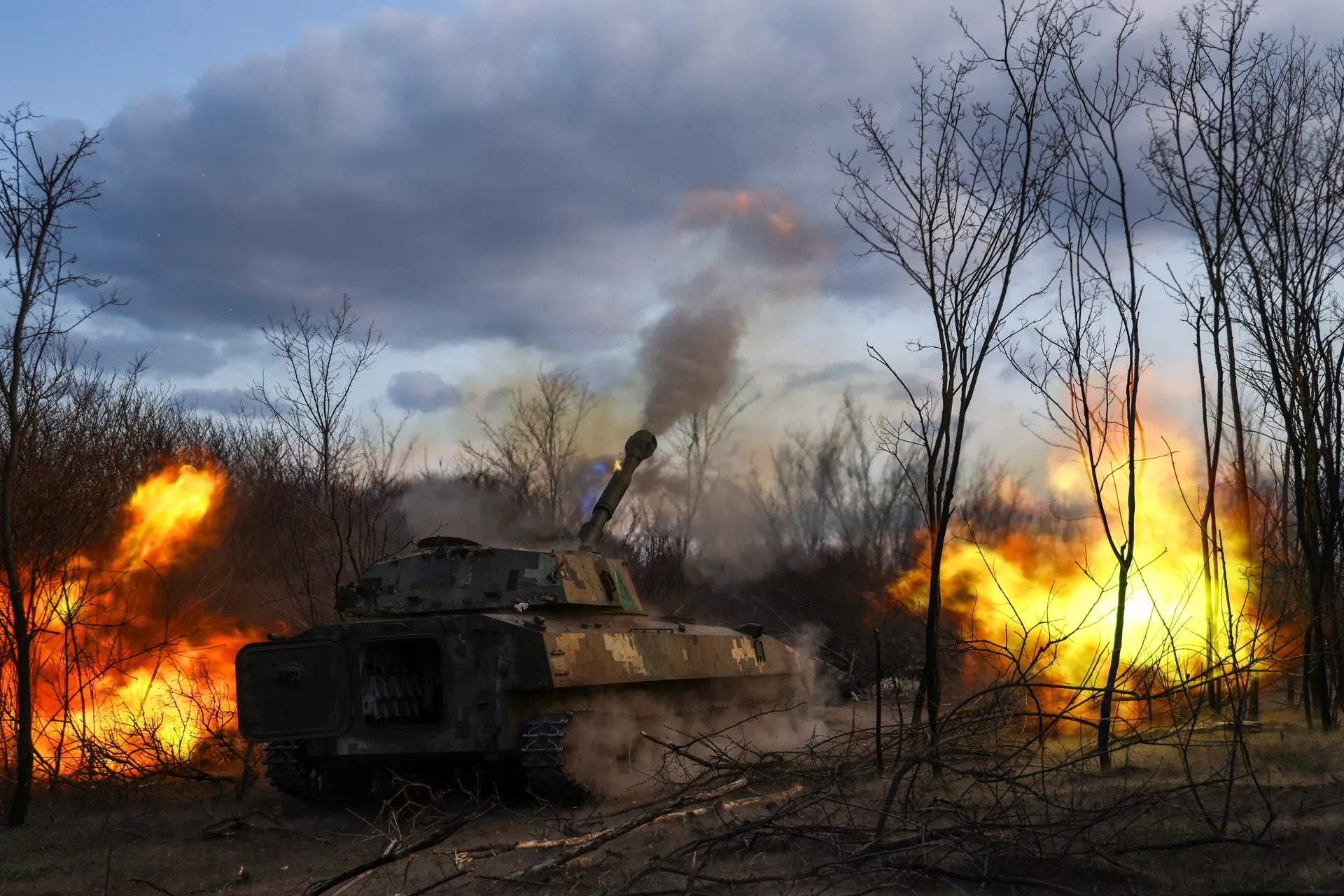 Artillerymen of the 39th Coastal Defense Brigade fire from the 2S1 Gvozdika self-propelled howitzer at Russian positions near the villages of Krynky and Kozachi Laheri on the occupied left bank in March 2025 in Kherson Oblast, Ukraine