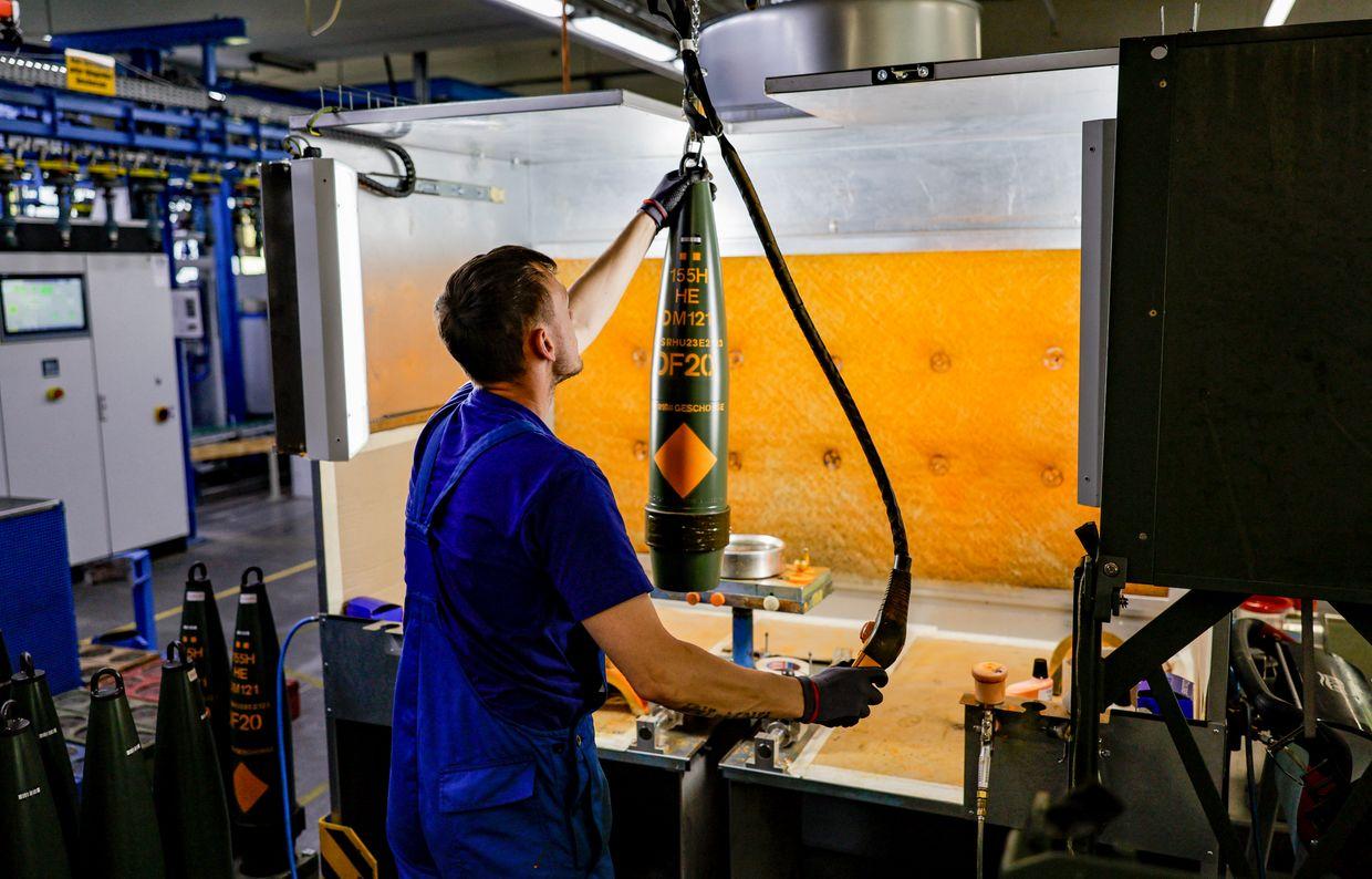 A technician of German arms maker Rheinmetall labels 155mm shells for the Panzerhaubitze 2000 howitzer at the company’s facility in Germany