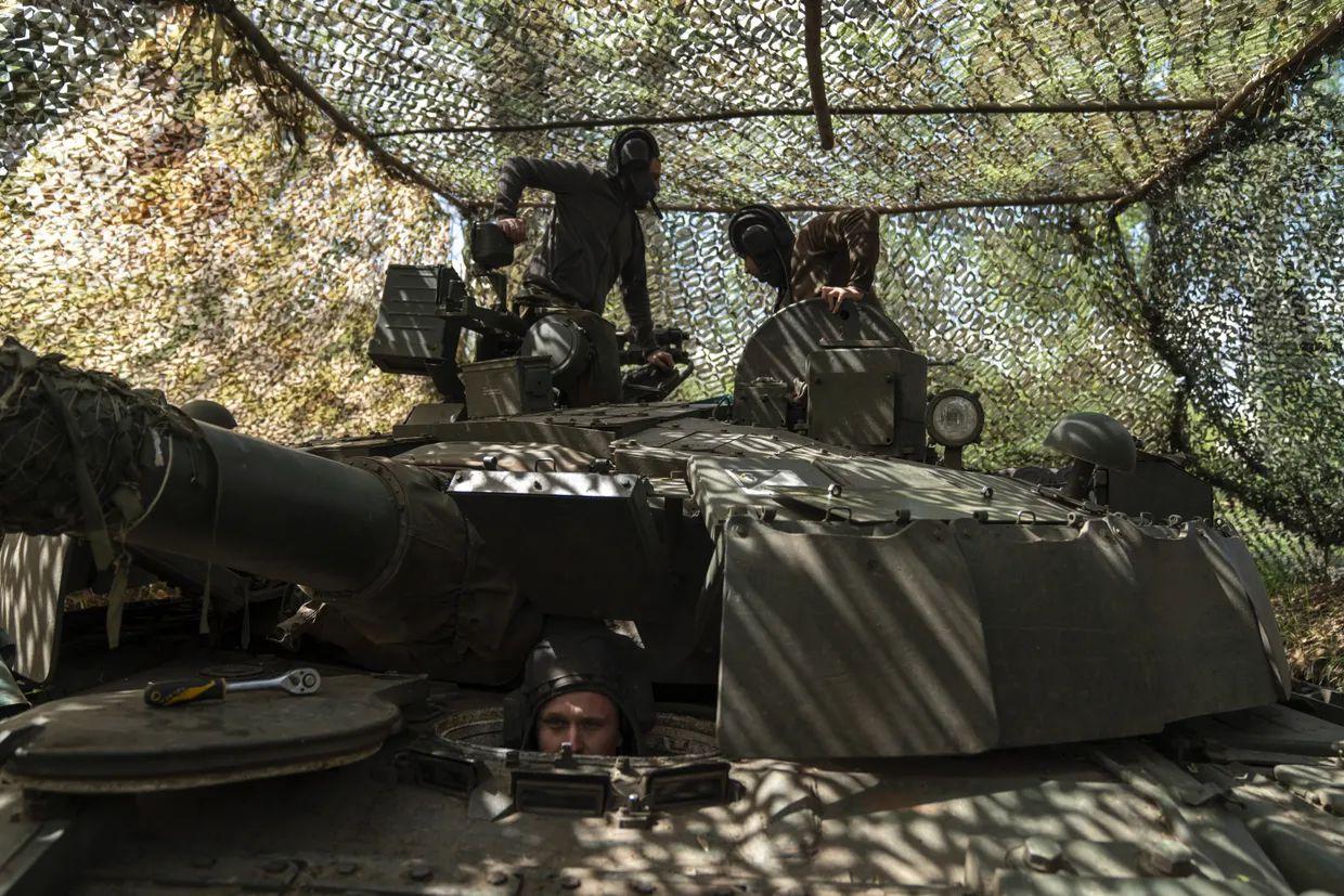 A group of Ukrainian military engineers and army tankmen prepare and maintain a T80 tank, captured in the fighting between the Ukrainian army and Russian soldiers, by placing it in a new position in Kostiantynivka district in Donetsk Oblast, Ukraine
