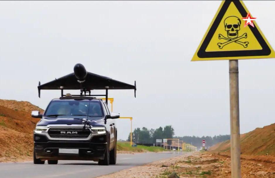 An American Ram 1500 pickup truck with a Russian suicide drone on top, captured on video released by the Russian Defense Ministry's TV channel on July 20, 2025