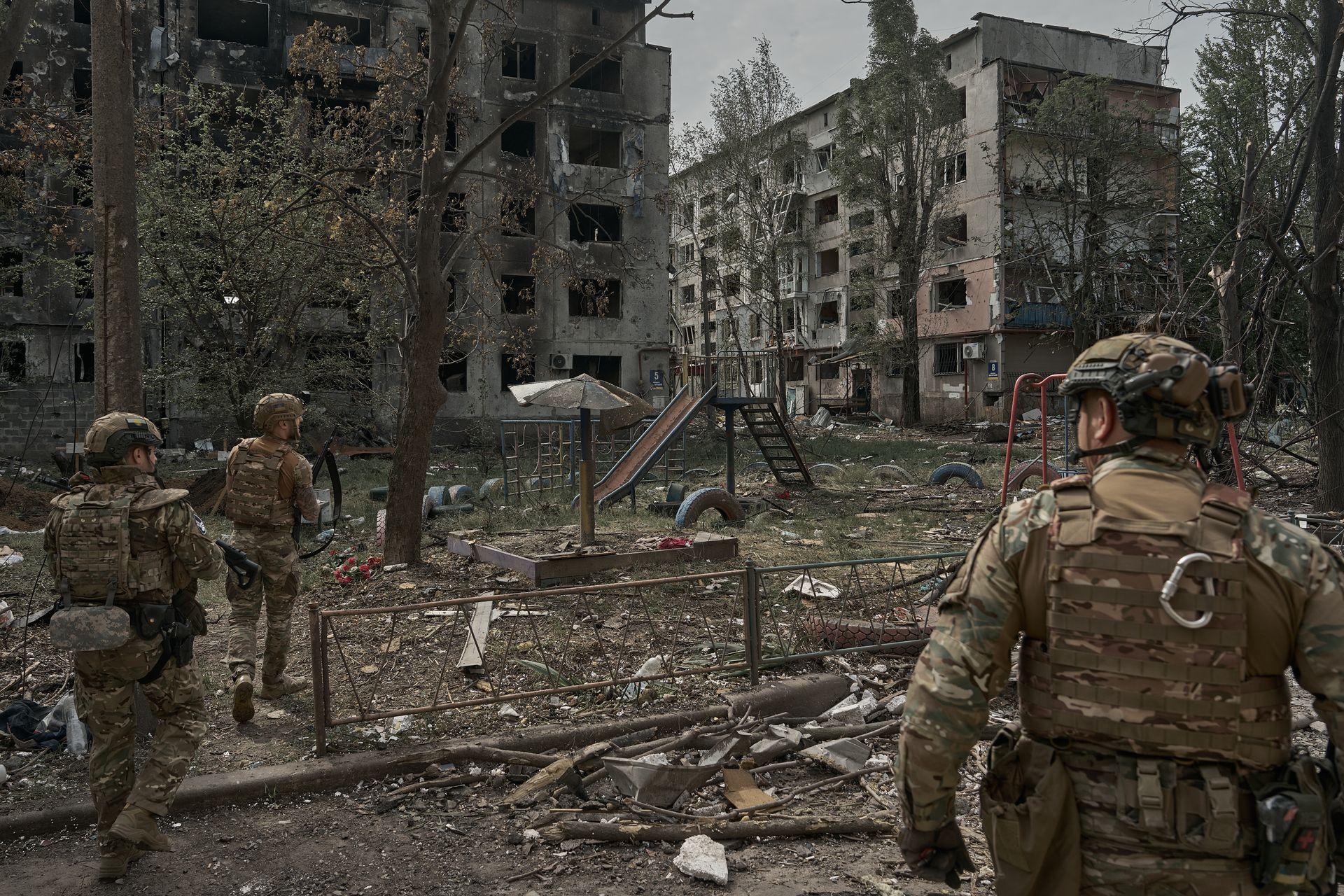 “White Angels” unit of the National Police of Ukraine walk through a destroyed neighborhood during the evacuation of civilians in Pokrovsk, Donetsk Oblast, Ukraine in Summer 2025