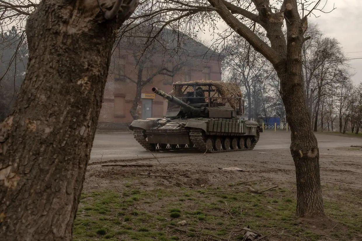 Ukrainian tank drives on a road in a village in Dnipropetrovsk Oblast, Spring 2025